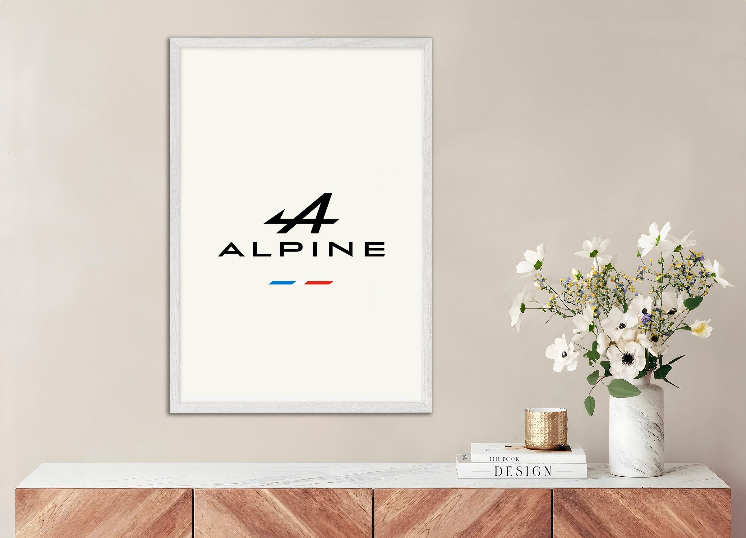 Poster of Alpine logo, with white wooden frame